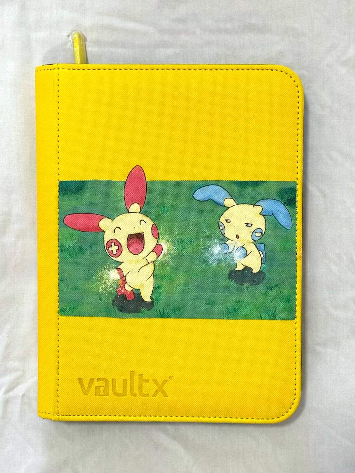 Plusle and Minun hand painted on a yellow binder